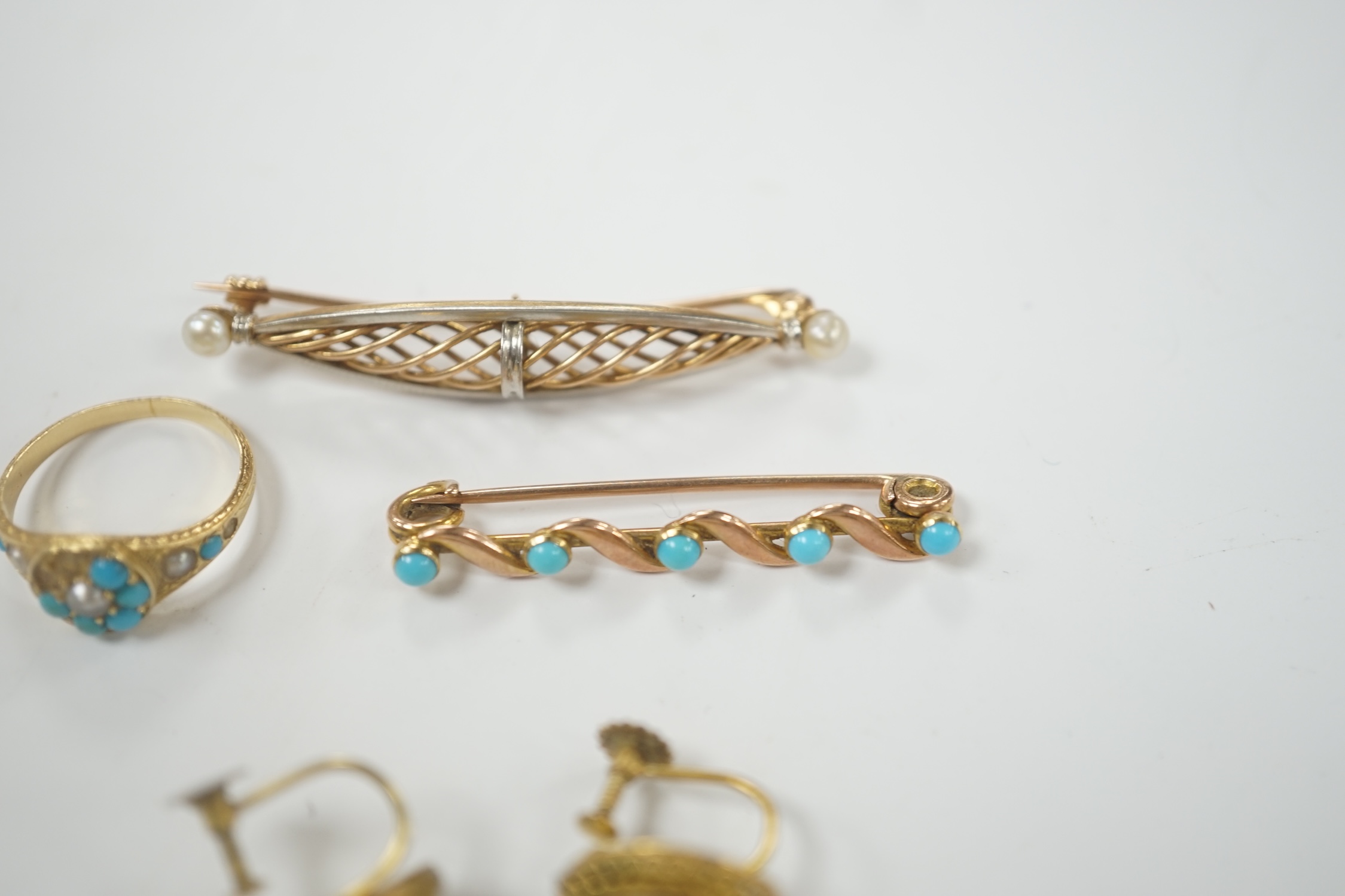 A pair of early 20th century 9ct and turquoise cluster set ear clips, 13mm, together with two yellow metal and gem set brooches and a yellow metal, turquoise and seed pearl cluster set ring (stones missing), gross weight